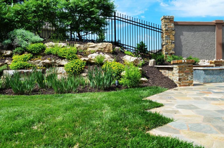 Trimmed lawn and stone walkway