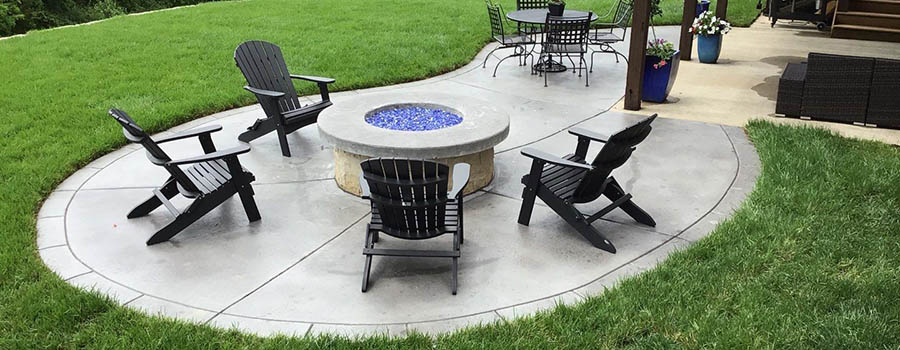 Patio with seating around a firepit
